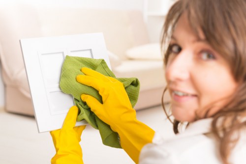 Professional upholstery cleaning equipment on a fabric chair